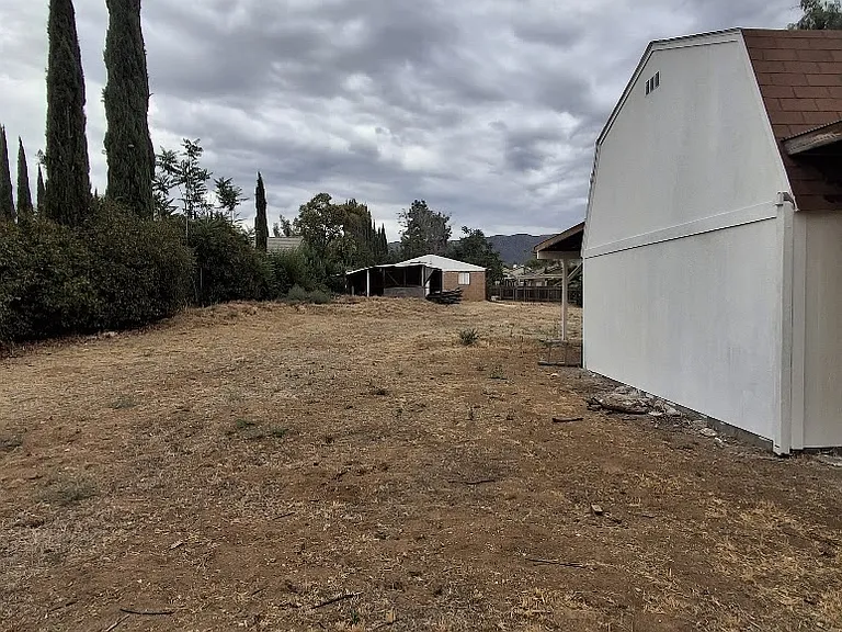 picture of small barn showing property in the yard