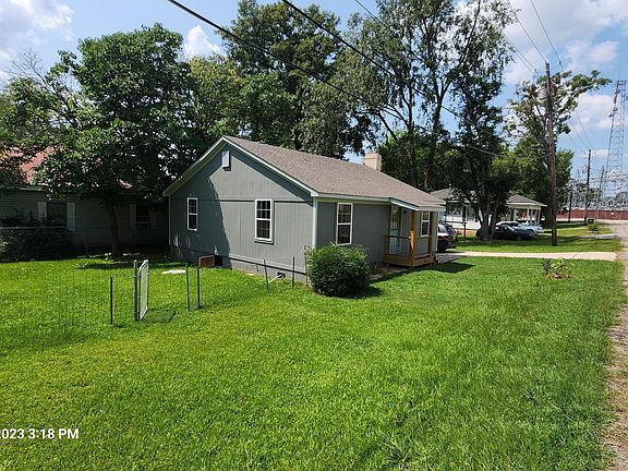Outside left side of house.