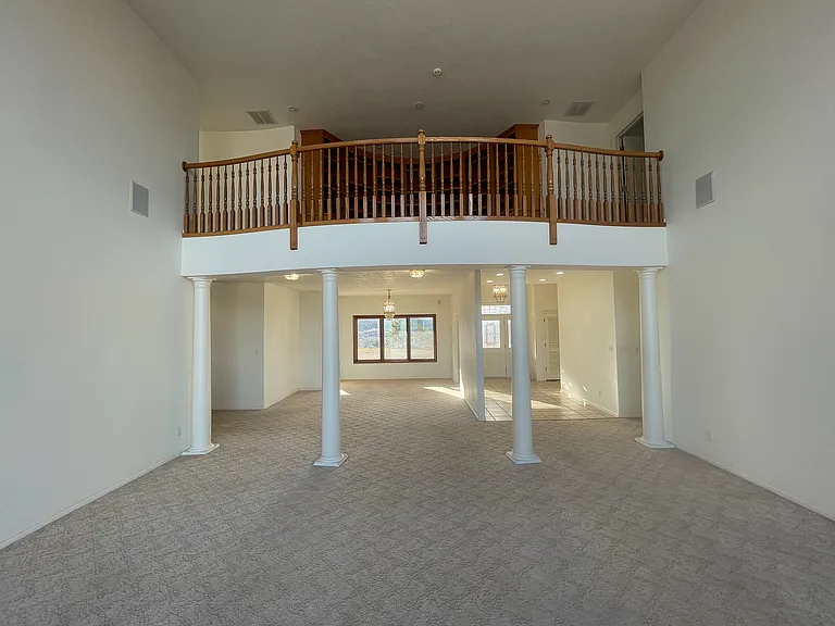 The grand living room, with two-floors makes all family gatherings a delight.