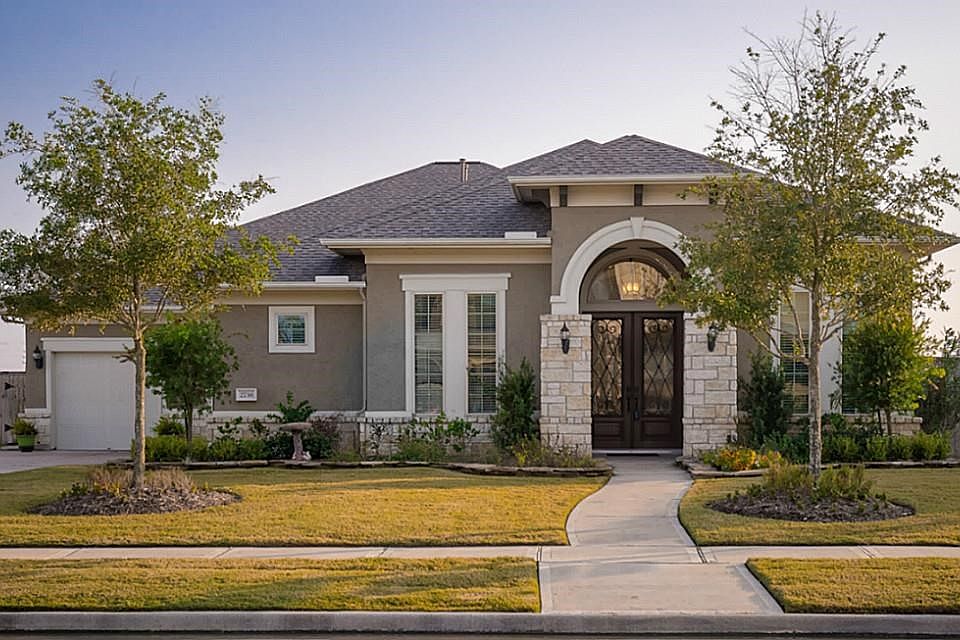 Gorgeous Taylor Morrison Home with lots of upgrades.  Stone/Stucco elevation gives warmth and richness to this spacious floor plan.  Green belt to the left of the home and behind add to the spaciousness of the lot!