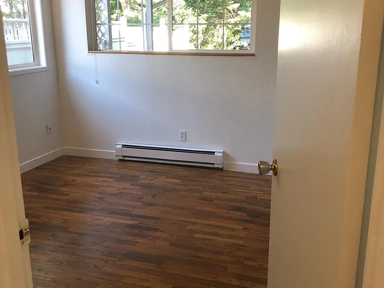 Bedroom 1 - baseboard heater being replaced by wall heater