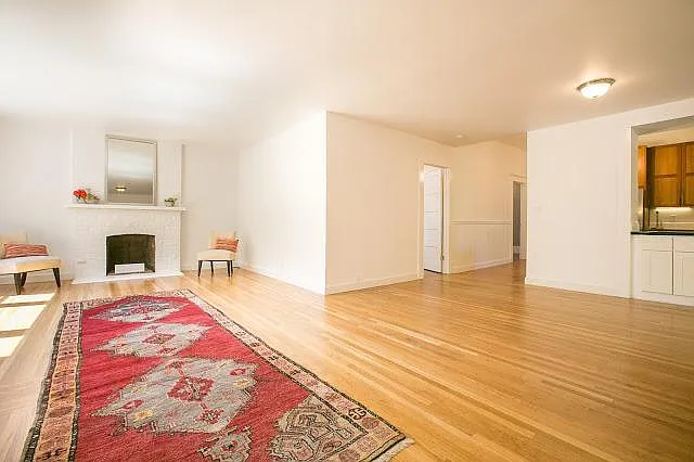 Looking from entertainment door toward living room dining area, master bedroom door and kitchen entrance.