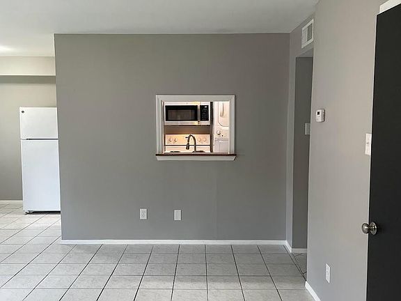 Newly added window opens up the kitchen to the living room.