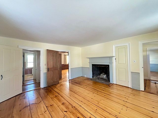 First floor bedroom with decorative fireplace