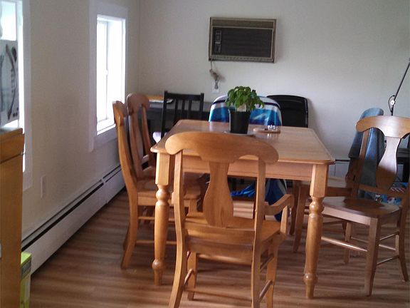 Dining Area, in front of house facing East, with built in air conditioning