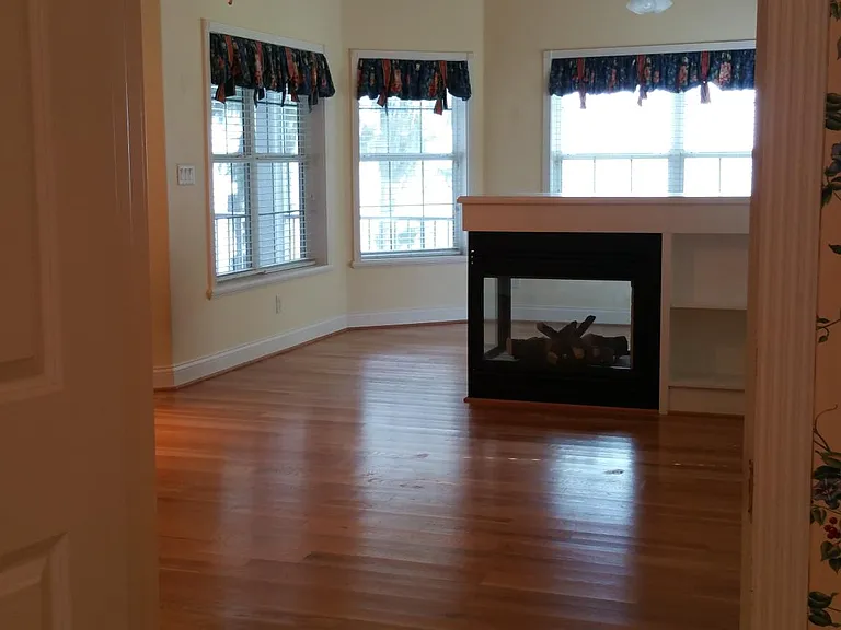 the Master BR view toward its reading nook overlooking the lake.