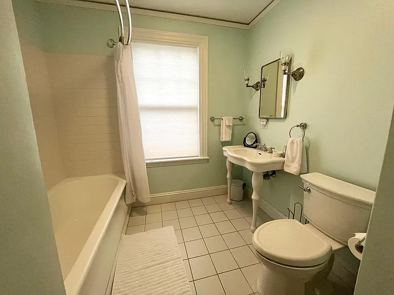 Second floor bath with deep soaking tub.