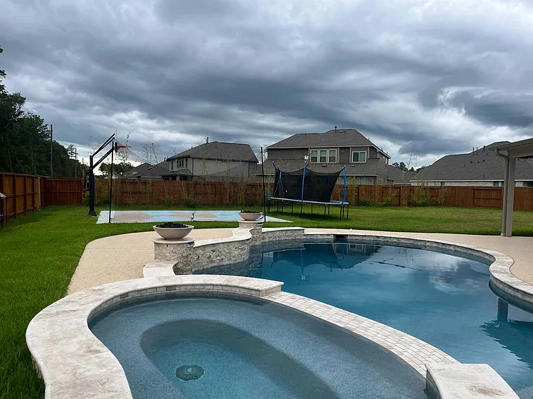 Basketball half court 
18,000 gallon pool 
10 person hot tub 
3 feet to 9 feet deep