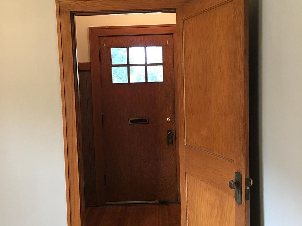 Front entry alcove and coat room.
