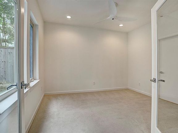 French doors lead to bedroom/study.