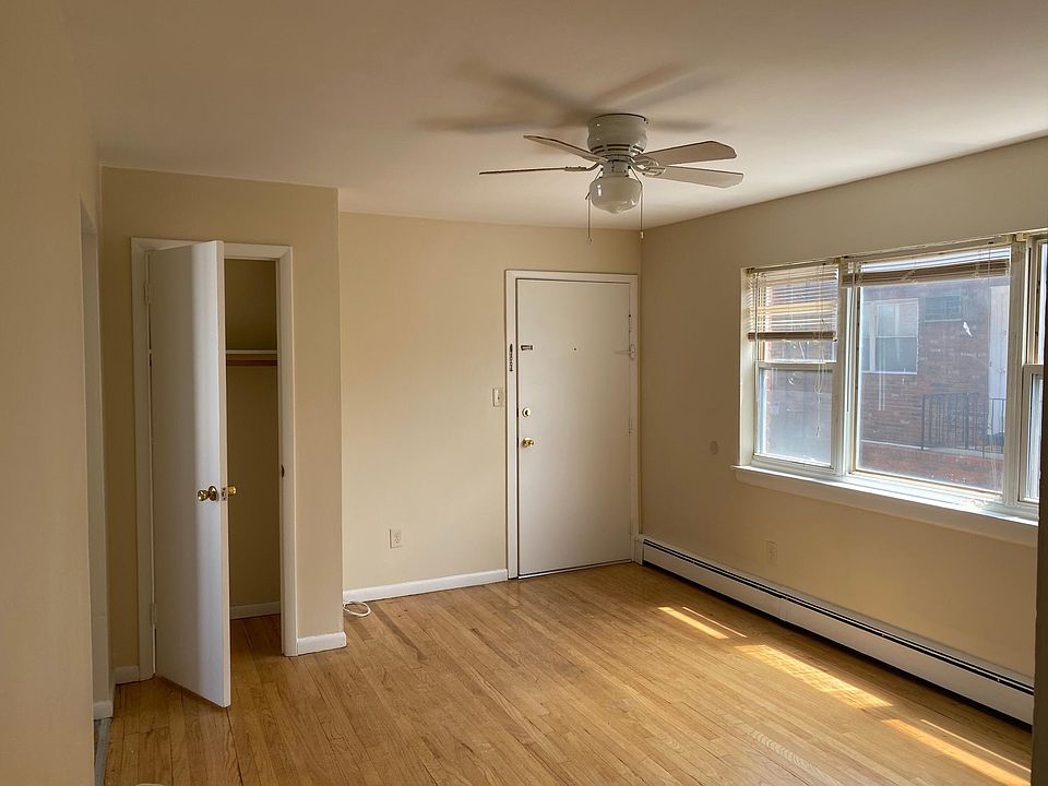 View of entrance from within- note one many closets and fan light fixture
