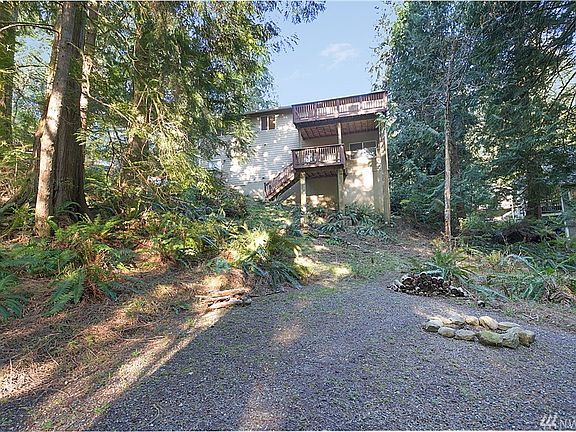 Looking from the back yard to back of the home. Low maintenance yard in front and back!