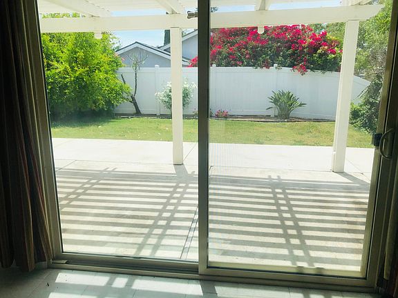 Access to backyard via sliding door in kitchen