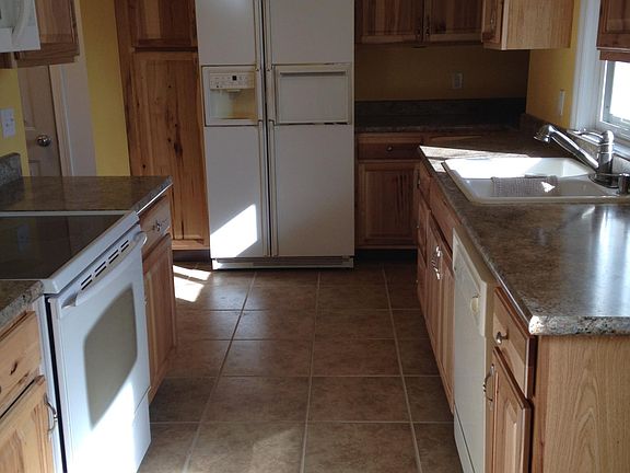 Kitchen with dishwasher, glass top range, and built in microwave
