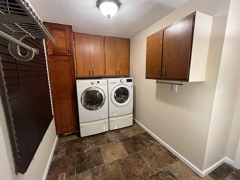 Spacious Laundry Room and pantry - NEW Washing machine and matching used but perfect Dryer - Both on Pedestals for easy load and use. New blinds - lots of utility cabinets.