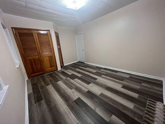 (Master Bedroom 2/3) The main built in closet offers a rod for hanging clothes.