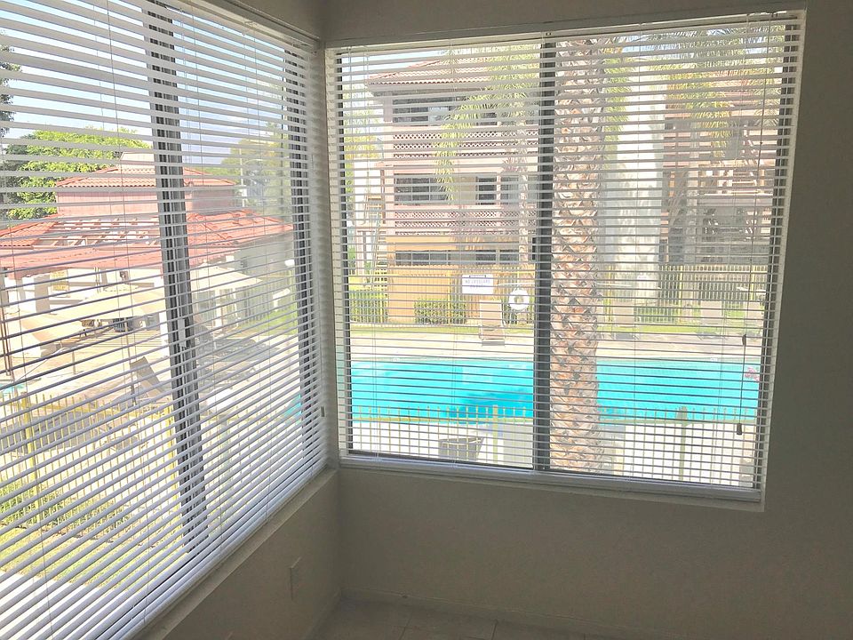 Living room with windows towards pool