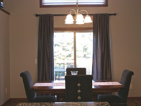 View from the kitchen to the dining room and back yard.