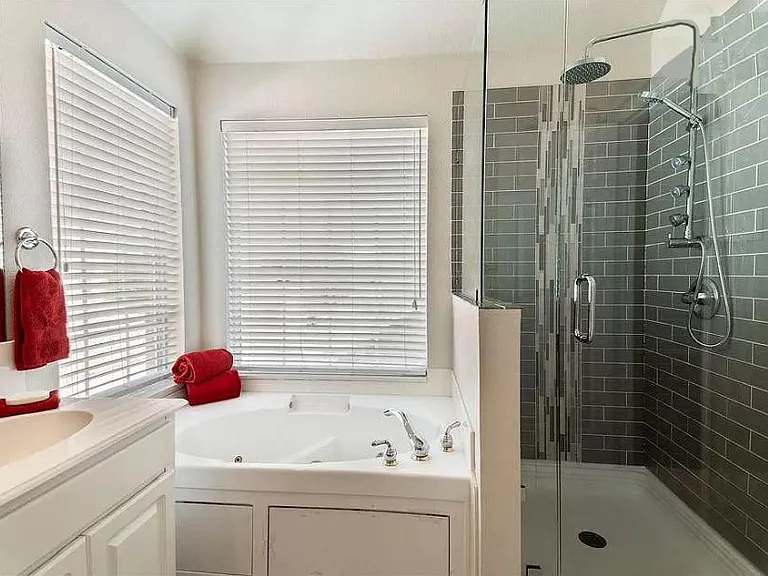 Prime Bath #3 looking south at Jacuzzi jetted tub & shower