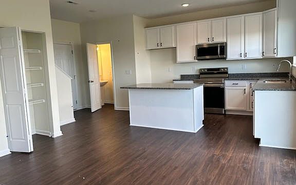 Kitchen with Pantry and powder room view