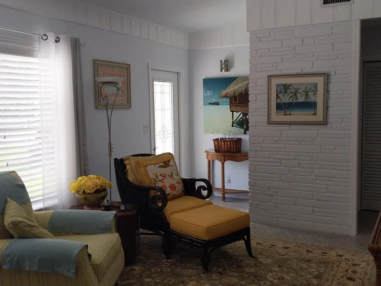 Living room, looking towards front door.