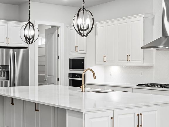 A Luxurious Chef s Kitchen with a Walk-In Pantry in the Creighton at South Lake