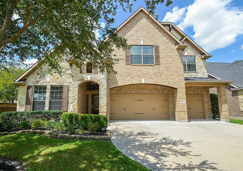 Beautiful Cinco Ranch Southwest home with a pool! Walking distance to elementary school! Upgraded brick and stone elevation, with a Full 3 car garage!