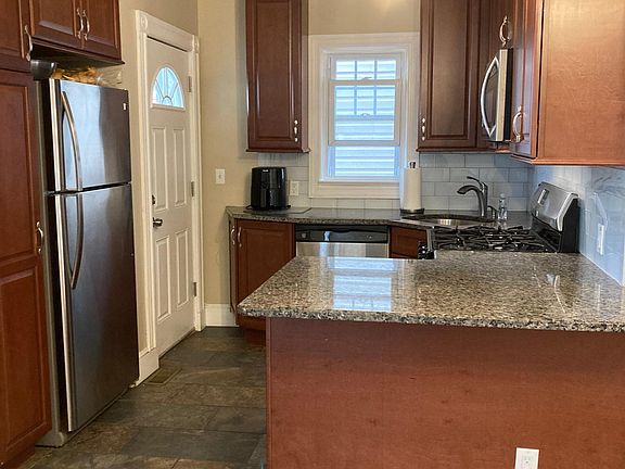 Kitchen showing 2nd, rear private entrance.