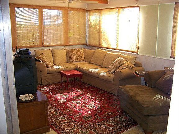 Comfortable family (in addition to formal living room) opens onto 15x18 porch