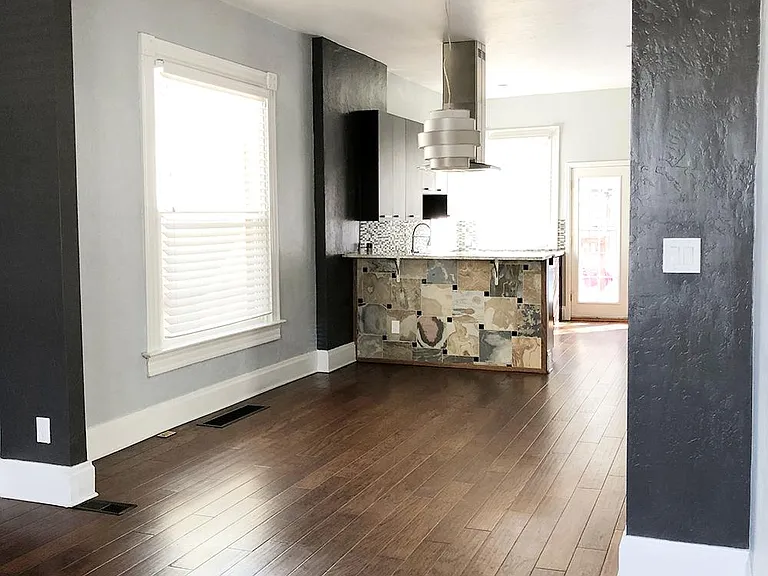 The open floor plan seamlessly moves from living to dining to kitchen.