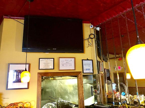 Flatscreen TV from bar view