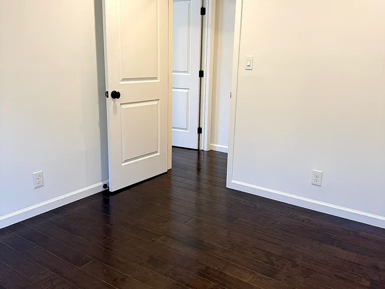 Bedroom 3 with dimmable recessed LED lighting.