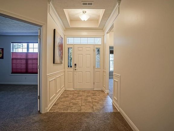 Front entry way with bedroom 4 with large closet option to the left and 2 guest bedrooms to the right (photo view)