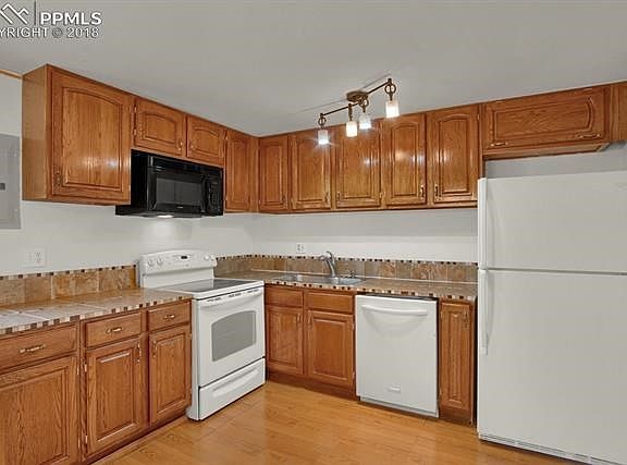 Wood laminate floor * tile counter tops and back splash * all appliances included