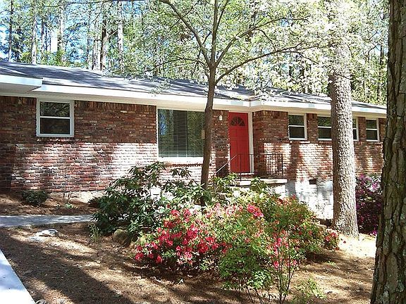 Approach to home and view of native landscaping