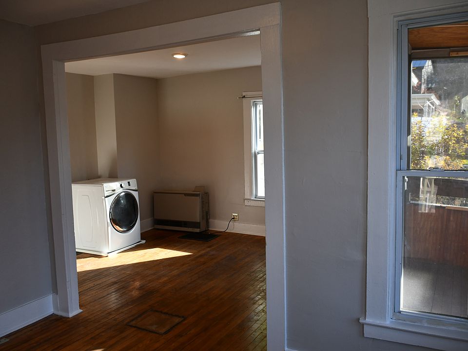 Looking into dining room. You can see the screened porch through the window as well.