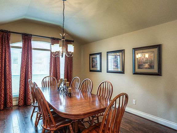 Hand scraped engineered wood floors in the spacious dining room.