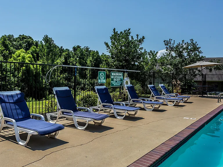 Relax by the poolside in this serene and sunny outdoor space, perfect for unwinding.