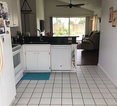 Fully equipped kitchen with kitchenware. Relatively new and quiet dishwasher. Brand new garbage disposal. Kitchen has access to a double-car garage which houses washer and dryer.