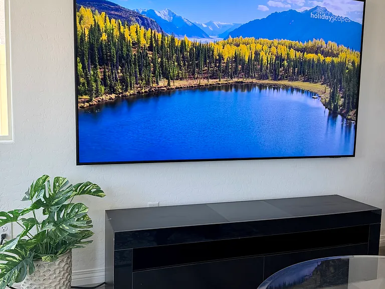 85" Samsung tv with media center console below for ample storage