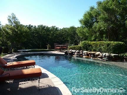 Pool
						:
						Pebble Tec lined pool with stone waterfalls, tanning deck and sitting areas.