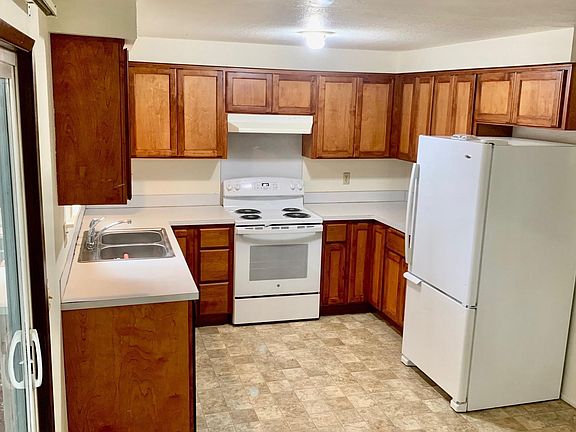Updated kitchen with new dishwasher and range and refinished cabinets.