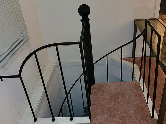 Spiral stairs to lower level