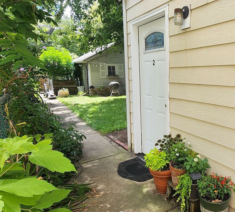 Private back/side door, within fenced-in backyard with gated entrance.