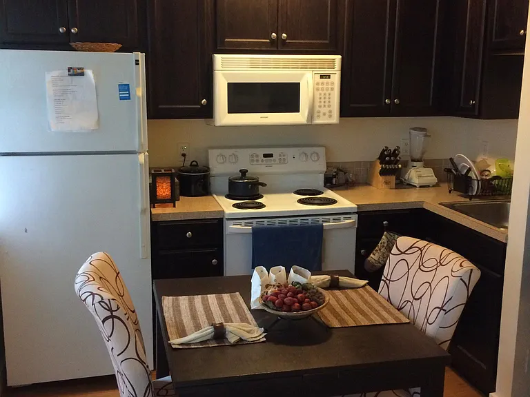 Studio has a full kitchen (fridge, freezer, range, microwave, sink, and lots of cabinetry.