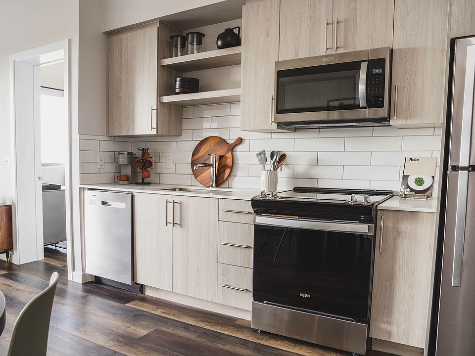 The kitchen features sleek stainless steel appliances.