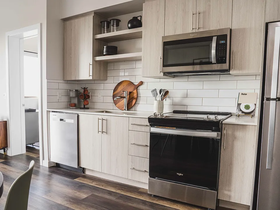 The kitchen features sleek stainless steel appliances.