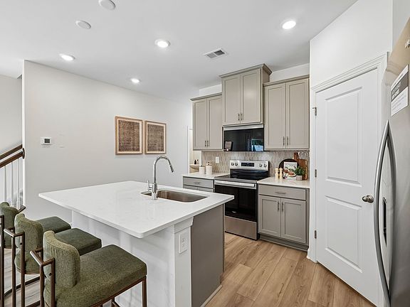 Turn the oversized kitchen island into a bar counter for additional seating.