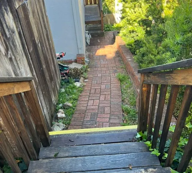 Stairs at side of home. Lush landscaping maintained by gardener. Entire unit has updated and current features.