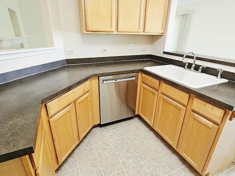 Kitchen with new stainless dishwasher.